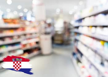 A store shelf with personal care products, slightly out of focus, with a Croatia logo in the lower left corner.