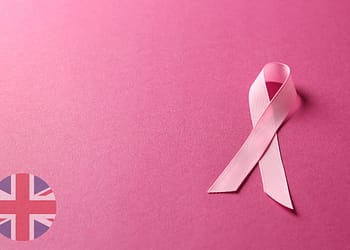 Pink ribbon on a pink background.