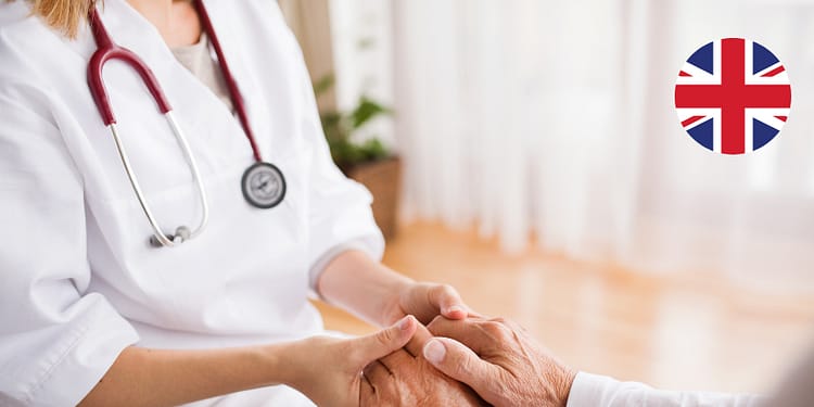 Doctor holding a patient's hands in a healthcare setting.
